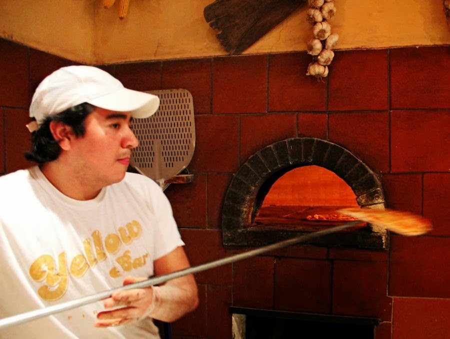 Stock Pictures: Cooking pizza in a wood fired brick oven in Italy Stock Pictures: Cooking pizza in a wood fired brick oven in Italy